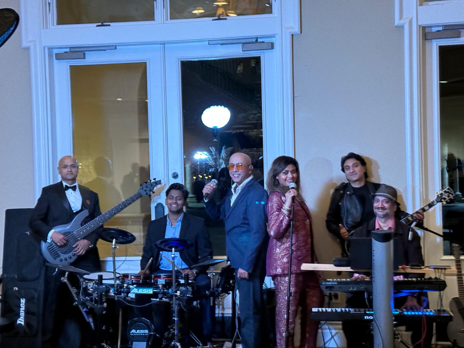 Karma And The Six band members in formal attire