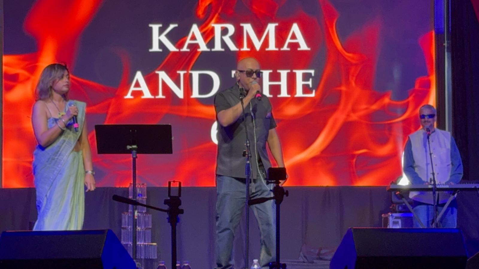 Stage performance with band backdrop